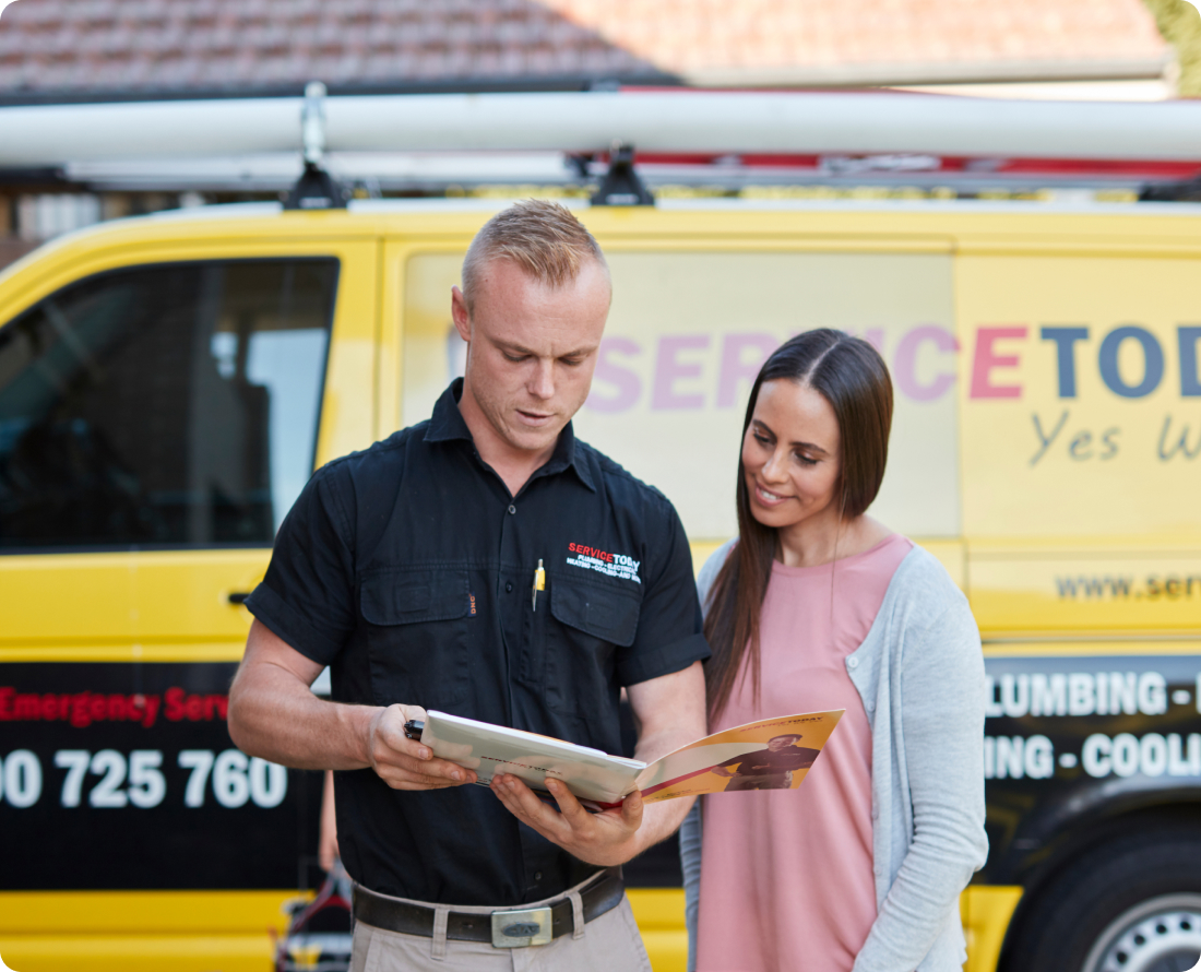 Service Today technician and customer discuss leak detection at a home.