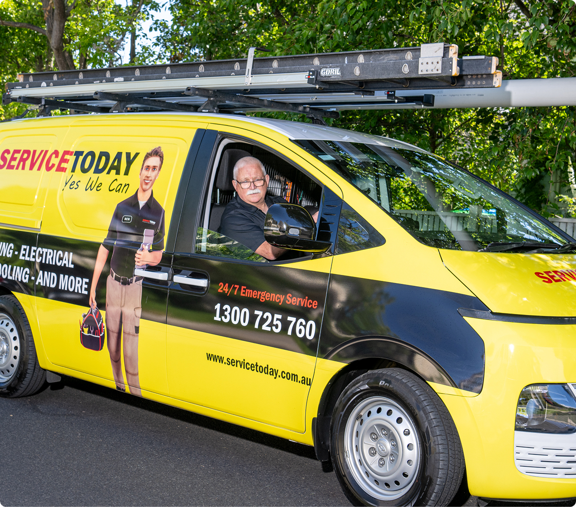 Service Today van with employee, offering 24/7 emergency service.